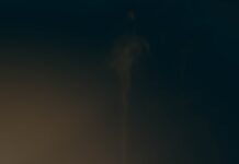 장마철 감기 예방법 a white cup with steam rising out of it