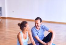 겨울철 마음을 따뜻하게 하는 요가 자세 man in white tank top and gray pants sitting on blue yoga mat