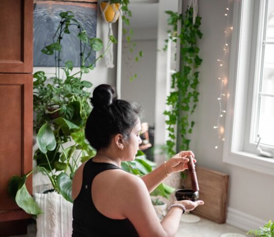 스트레스 해소를 위한 명상 가이드 a woman sitting on a pink mat