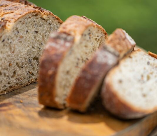 건강을 위한 영양소 섭취와 운동 a loaf of bread sitting on top of a cutting board