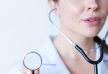 20~30대 건강검진, 어디까지 받아야 할까? a woman in a white shirt holding a stethoscope