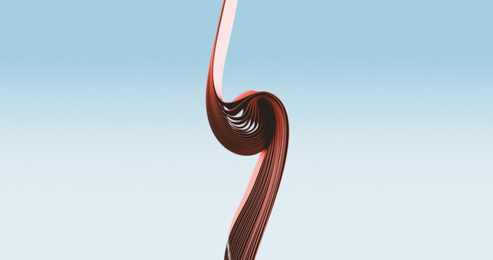 a curved red object on a blue background
