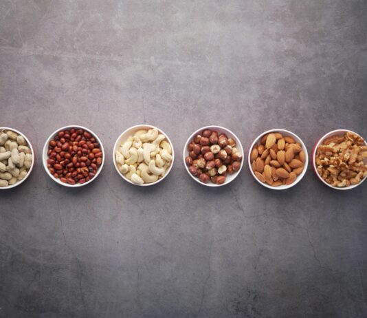 근감소증 예방, 꾸준한 근육 관리로 건강한 노후 준비하세요 brown nuts on white ceramic bowls