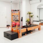 필라테스, 건강한 몸과 마음을 만드는 현대인의 운동 트렌드 a gym with a treadmill and exercise equipment