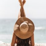 여름철 건강, 올바른 관리로 무더위도 거뜬하게! woman in brown sun hat standing on beach during daytime