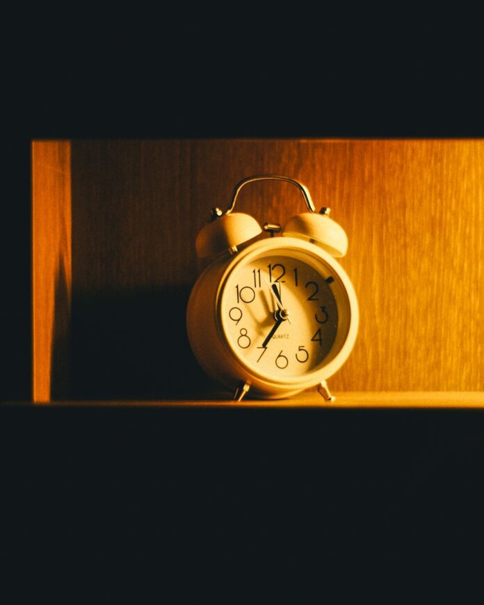 Photo by Luminos film a clock on a shelf