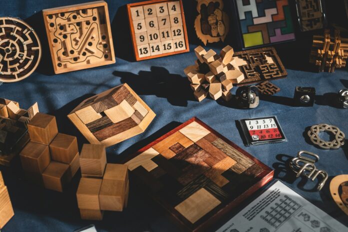 Photo by Jonathan Kemper brown wooden blocks on blue textile
