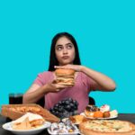 “먹어도 배고픈 이유?” — 스트레스성 폭식의 뇌 과학 a woman holding a burger