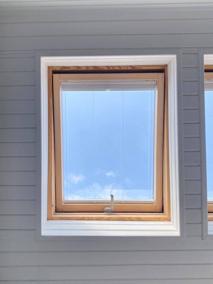 Photo by Deren Deste white wooden framed glass window