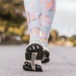 집에서도 가능한 ‘웰빙 걷기’ 열풍…일상 속 건강 챙기는 새로운 습관 person wearing black and white nike shoes