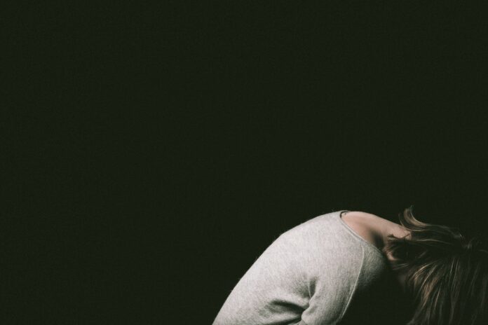 Photo by Malicki M Beser woman in gray long sleeve shirt