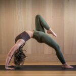 집에서도, 직장에서도…필라테스, 일상 속 건강 트렌드로 자리 잡다 a woman is doing a yoga pose on a mat