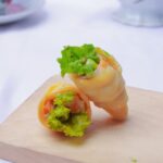 변화하는 직장인 건강 트렌드, “작은 습관이 건강을 지킨다” a wooden cutting board topped with a vegetable roll