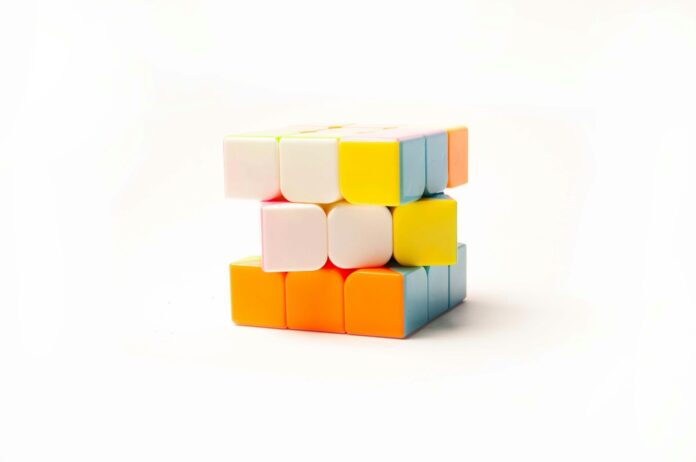 Photo by Lidia Nemiroff a stack of colorful blocks sitting on top of each other