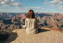 “일상 속 뇌 건강 지키기, 작은 습관이 큰 변화” woman sitting on hill