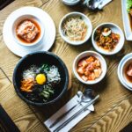 “하루 한 끼, 건강하게 채식 즐기기…쉽게 시작하는 플렉시테리언 라이프” multiple dishes field bowls on table