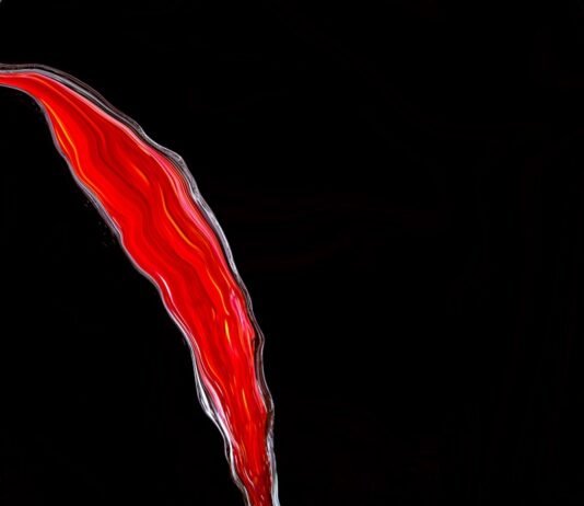 혈당의 역습, ‘무엇’을 먹느냐보다 ‘어떻게’ 먹느냐가 당신의 노화를 결정한다 red light on black background