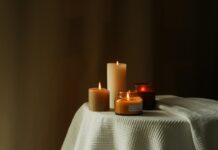 일상 속 대체요법, 건강을 위한 새로운 선택지로 주목받다 three lit candles sitting on a white table cloth