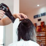 두피부터 모발까지, 건강한 헤어 라이프스타일 최신 트렌드와 실천법 woman in white shirt holding hair blower