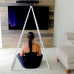 “하루 10분, 집에서 시작하는 ‘마음챙김 명상’…일상 속 스트레스 관리법으로 주목” woman sitting in white triangle rods