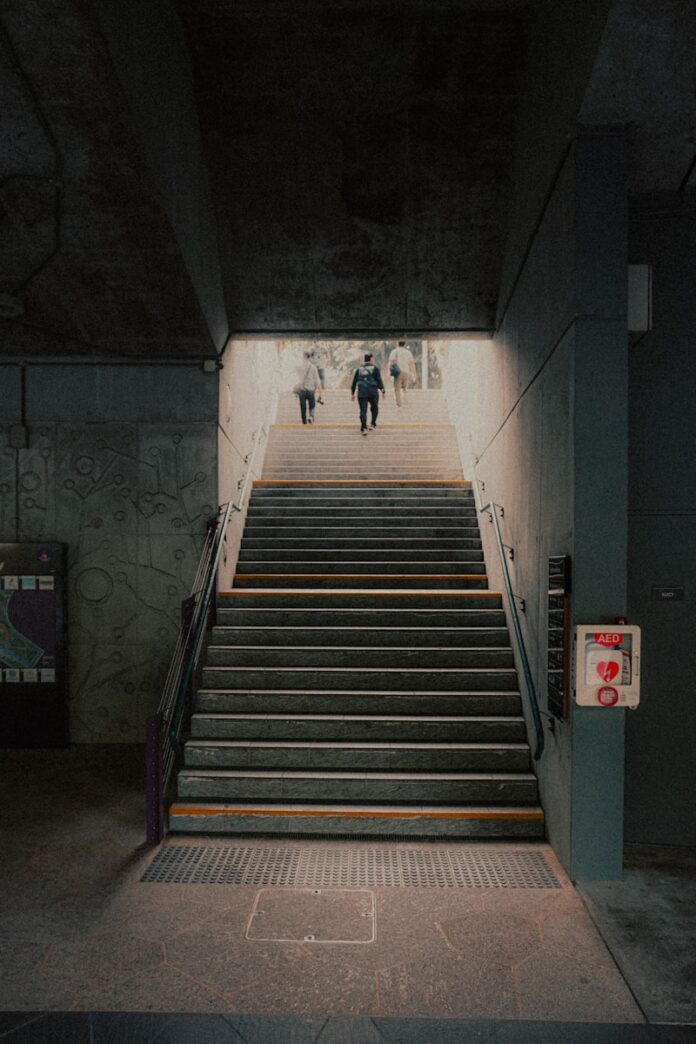 A group of people walking down a flight of stairs