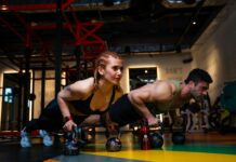 “근육 챙기는 일상, 이제는 건강 관리의 기본” a man and a woman doing push ups with dumbbells