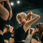 림프 순환의 마법, 춤추고 나면 얼굴이 맑아지는 이유 woman in black tank top raising her hands