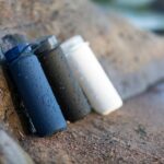 여성 건강, 작은 변화로 지키는 일상 습관의 힘 black and white plastic containers on brown sand