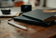 마음 챙기기가 일상이 되는 시대… 정신건강 지키는 생활 습관 제안 a couple of books sitting on top of a wooden table