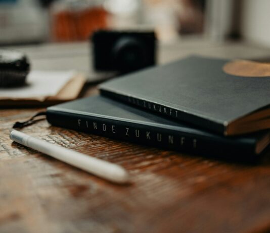 마음 챙기기가 일상이 되는 시대… 정신건강 지키는 생활 습관 제안 a couple of books sitting on top of a wooden table