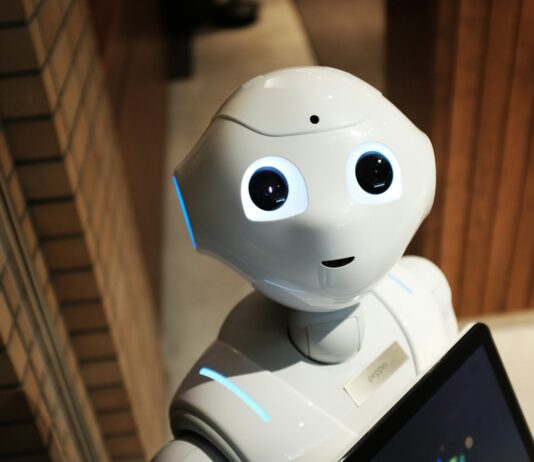 “AI 건강관리, 내 손안의 주치의로 일상에 스며든다” white robot near brown wall