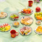 한국 직장인 만성피로, ‘마이크로 휴식’과 라이프 밸런스 실천이 대안으로 주목 A picnic spread with various fruits and pastries.