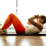 “근육 건강, 일상의 작은 변화가 큰 힘 된다” woman exercising indoors