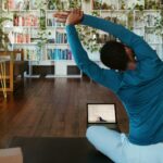 미니멀 홈트 열풍, 일상 속 ‘작은 운동’ 실천법 주목 a man doing yoga in a living room