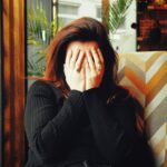 만성피로, 단순한 피로감이 아니다… 원인과 관리법은? woman in black long sleeve shirt covering her face