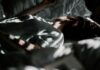 “숙면이 대세! 일상 속에서 쉽게 실천하는 건강한 수면 습관” a person laying in a bed under a blanket