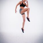 “바쁜 당신을 위한 건강 솔루션, 마이크로 워크아웃의 매력” woman jumping near white wall paint