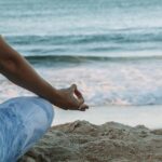스트레스 관리, 일상에서 시작하는 마음 건강 습관 person in blue shorts sitting on beach shore during daytime