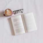 생활 속 뇌건강 관리, 가까이에서 실천하는 새로운 습관들 book near eyeglasses and cappuccino