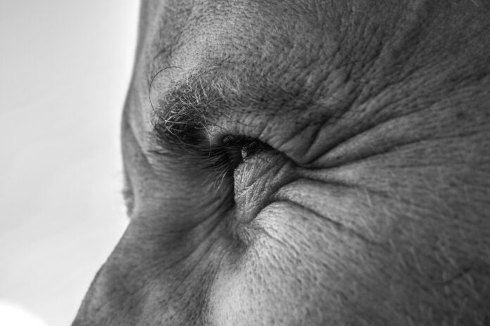Photo by Raisa Milova grayscale photo of persons right ear