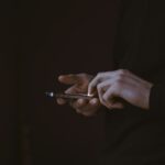 웰니스 문화, 일상을 바꾸다…한국에서도 확산되는 건강한 삶의 습관들 silhouette photo of person holding smartphone