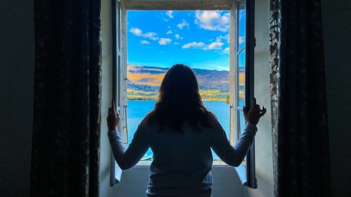 a person looking out a window
