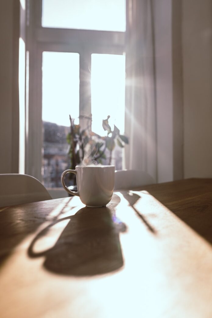 Photo by Aimee Giles a vase sitting on top of a wooden table