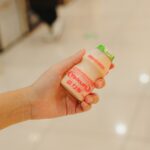 우리의 일상 속 장 건강 지키기, 작지만 큰 변화 Hand holding a bottle of yakult