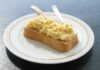 “마음챙김 식사법, 바쁜 한국인의 건강한 일상 열쇠로 부상” A piece of bread topped with scrambled eggs on a white plate