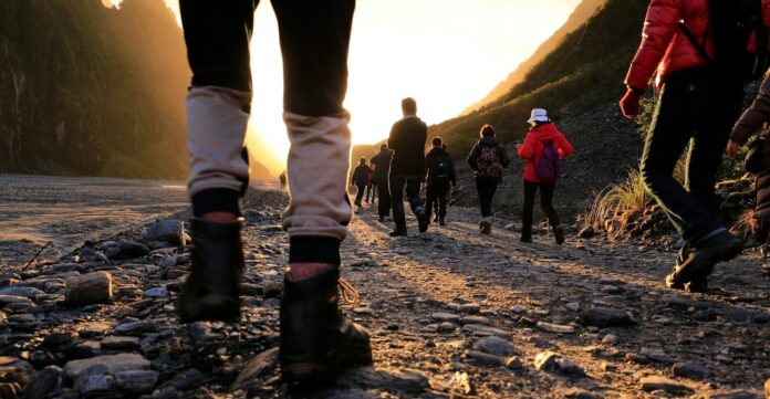 Photo by Henry Xu person wearing black work boots
